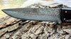 Detail photo of our special collectible fixed blade knife featuring a Japanese hand-forged blade with a combination of hammered 'claw' marks to honor our  beautiful and regal bald eagle on a river of damascus lines by SalterFineCutlery