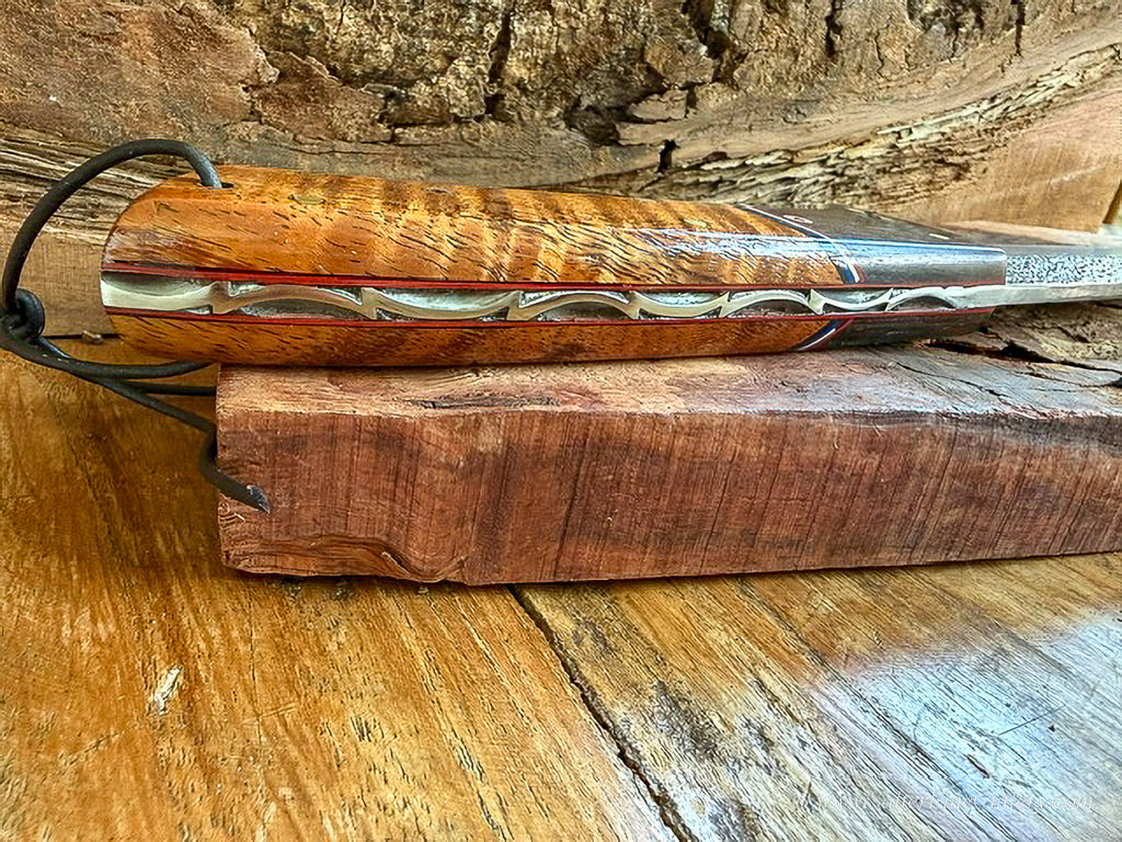 Detail close-up view of hand-filing edging done on the handle of a hand-forged collectible knife by SalterFineCutlery