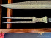 Close up view of a new carving knife set showing pattern on this hand-forged knife and fork