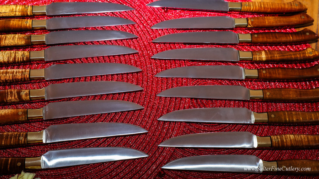 Twenty individually hand-forged steak knives for a fine dining restaurant in NYC with exotic rare koa wood handles by SalterFineCutlery