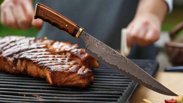 9-1/2 inch blade carving knife with curly koa wood handle and brass accents handcrafted from SalterFineCutlery