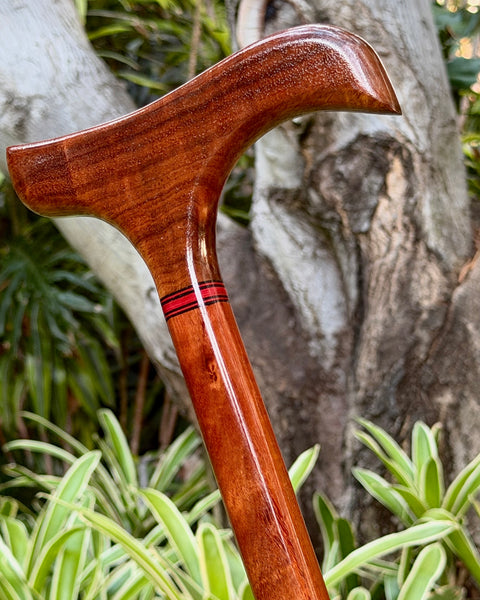 handcrafted Hawaiian curly koa wood cane or walking stick detail view of head shape and decorative features by SalterFineCutlery and custom woodworking
