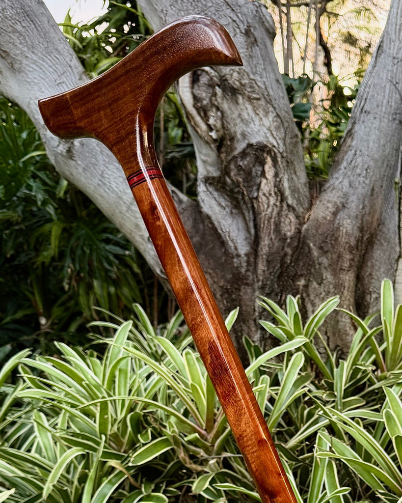 Handcrafted Curly Hawaiian koa wood cane by SalterFineCutlery and custom woodworking featuring our curved-rounded head with red-black decorative accents