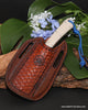 Hunting knife with white snake pattern handle and blue liners and trim in handcrafted handtooled leather belt sheath from SalterFineCutlery in Hawaii