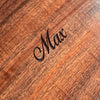 Detail view of personalized lid engraving on mens curly koa wood valet or jewelry box handcrafted by SalterFineCutlery and custom woodworking in Hawaii