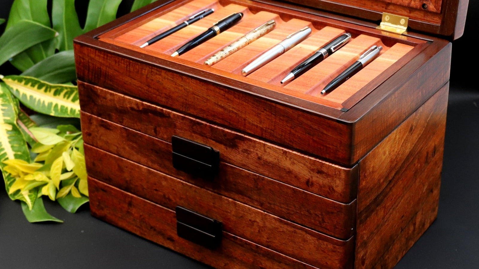 Handcrafted rare old-growth curly Hawaiian koa wood collection display box to hold 50 pens with 4 drawers and glass display top handcrafted by SalterFineCutlery custom woodworking