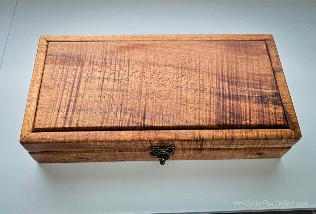 A handcrafted Hawaiian rare and exotic curly koa wood presentation box to hold a unique 250th anniversary special collectible knife by SalterFineCutlery