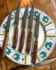 Six refurbished steak knives to illustrate knife condition after many years of use in a busy NYC restaurant servicing our clients at SalterFineCutlery