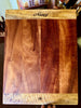 A personalized serving or cutting board handcrafted in Hawaii of koa and mango woods by SalterFineCutlery and custom woodworking