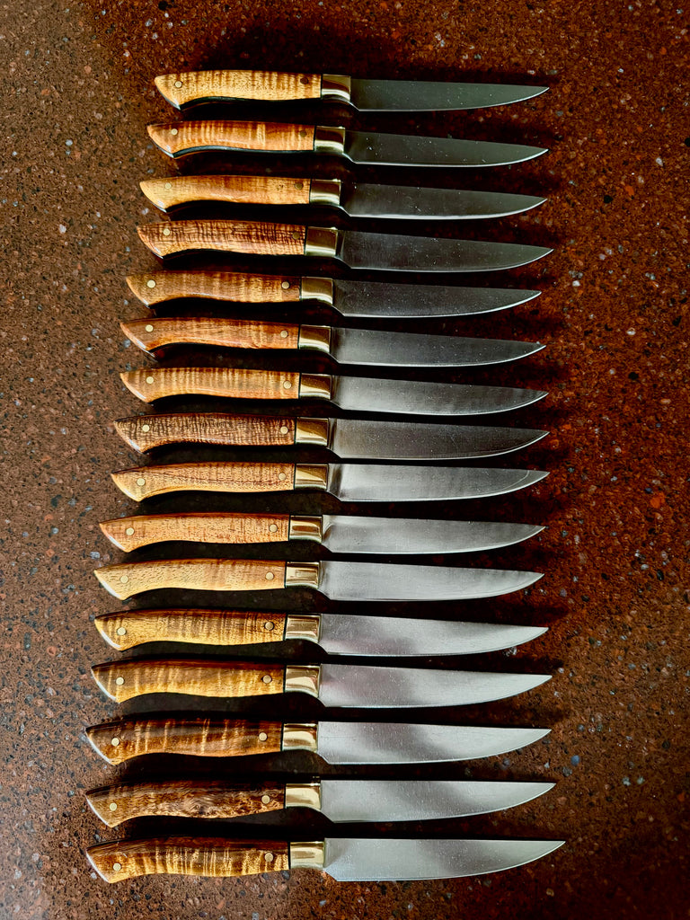 A set of 16 fixed blade steak knives after refurbishing service these knives had been in service at a famous high-end steak house for over 10 years. Refurbishng services of your knives by SalterFineCutlery