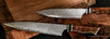 Two piece V6Super carbon damascus chef knife set in low light to show detail handcrafted in Hawaii from SalterFineCutlery with handforged Japanese blades