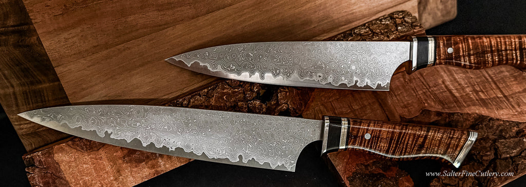 Two piece V6Super carbon damascus chef knife set in low light to show detail handcrafted in Hawaii from SalterFineCutlery with handforged Japanese blades